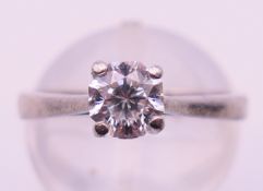 A platinum and diamond solitaire ring, the stone spreading to approximately 0.75 ct. Ring size I/J.