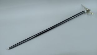 A walking stick, the handle formed as a Concorde. 91 cm high.