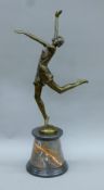 An Art Deco-style bronze dancing girl. 66 cm high.