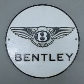 An iron 'Bentley' sign. 24.5 cm diameter.