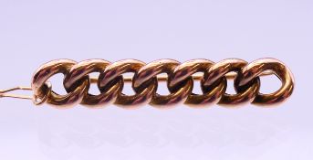 A 9 ct gold curb link brooch. 4 cm wide. 4.7 grammes.