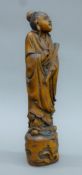 Two Chinese wooden figures. The larger 37 cm high.