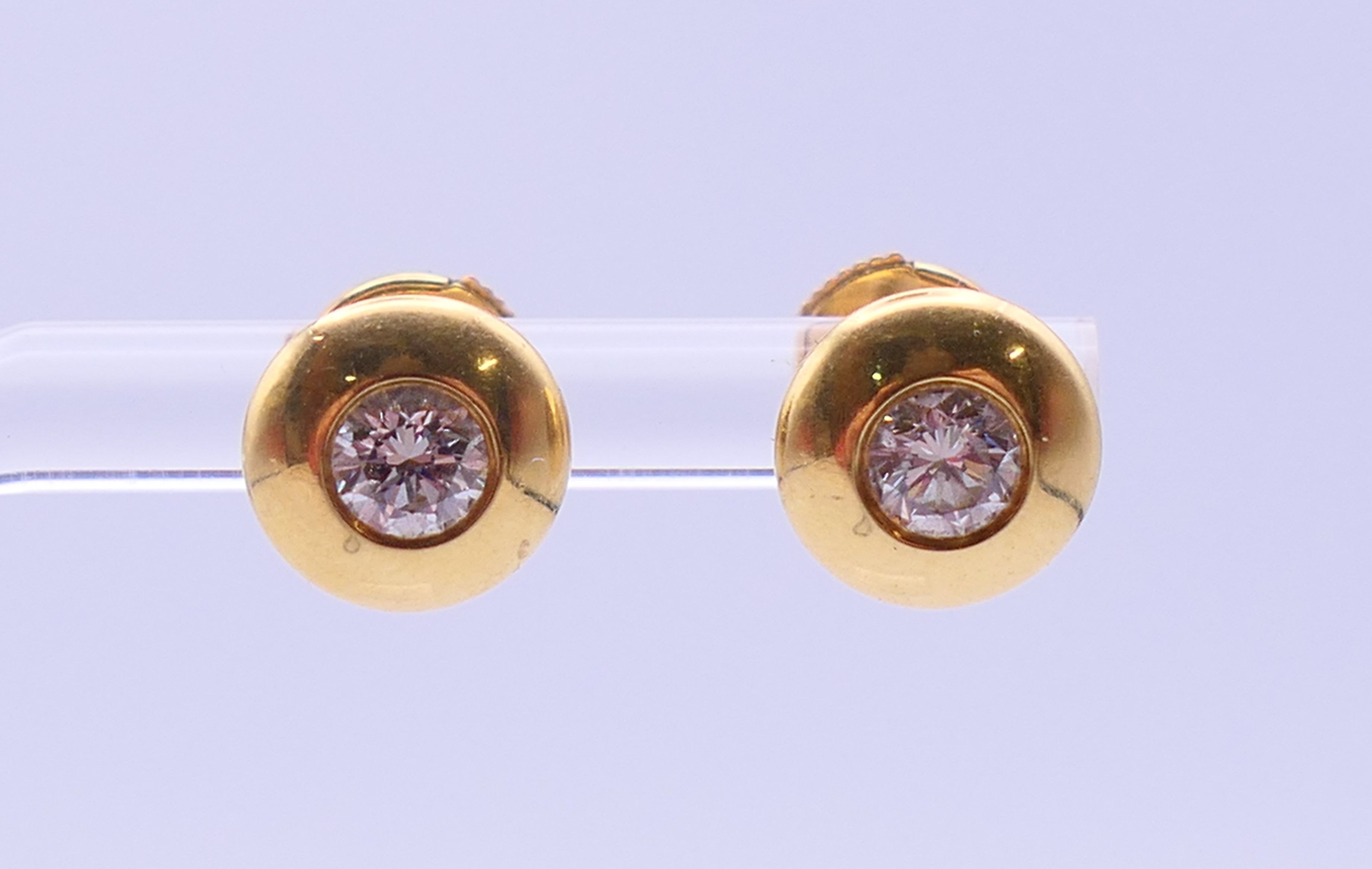 A pair of 18 ct gold and diamond ear studs, each stone approximately 0.25 ct. Each 8 mm diameter. 3. - Image 4 of 5