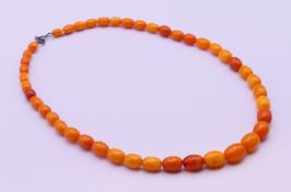 A butterscotch amber necklace. 41 cm long.