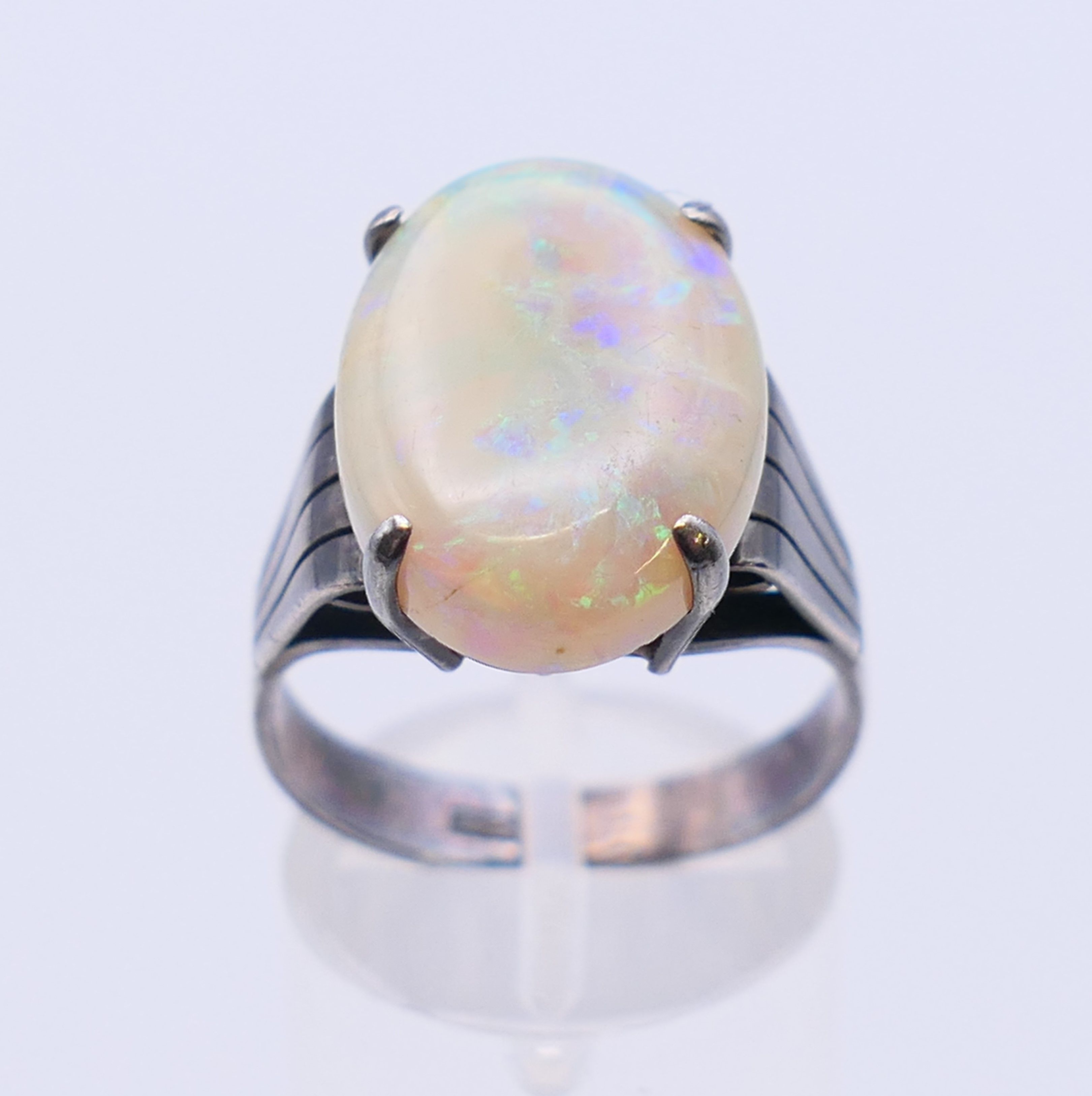 A silver and opal ring. The opal 1.8 cm x 1.2 cm. Ring size S. - Image 2 of 5