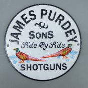 An iron 'Purdey' sign. 24 cm diameter.