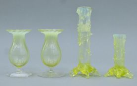 Four Victorian uranium glass vases. The largest 16 cm high.