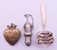 A George III silver and mother-of-pearl shovel shaped caddy spoon, hallmarked for Birmingham 1848,