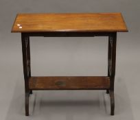 A Victorian walnut single drawer side table. 77 cm long.