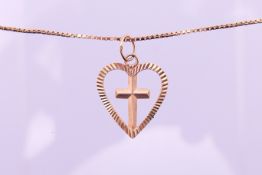 An unmarked cross within a heart pendant on a 9 ct gold chain. Pendant 2 cm high, chain 46 cm long.