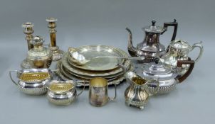 A quantity of silver plate, including salvers, tea sets, an oil lamp etc. The latter 19 cm high.