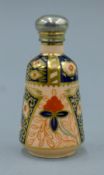 A silver-topped Imari porcelain scent bottle. 8 cm high.