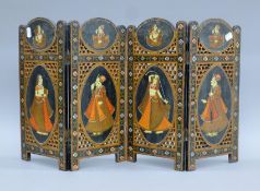 A small Persian folding screen decorated with figural portraits. 37.5 cm high x 18 cm wide folded.