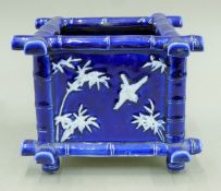 A 19th century faux bamboo pottery planter. 14 cm high.