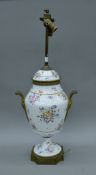 A French bronze and porcelain table lamp. 72 cm high overall.