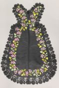 A 19th century embroidered and lace pinafore. 80 cm high.