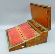 A 19th century brass-bound walnut writing slope. 54 cm wide.