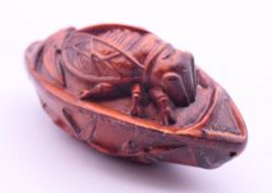 A carved cicada. 7 cm long.