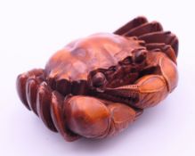 A carved crab. 7.5 x 5 cm.