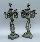 A pair of bronze Rococo candelabra. Each 54 cm high.
