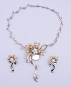 A costume pendant necklace and matching earrings.