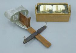 A Victorian/Edwardian stereoscopic viewer and various cards, including Ely Cathedral.