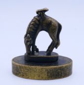 A bronze oval horse seal. 7.5 cm high.