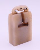 A jade seal. 9 cm high.