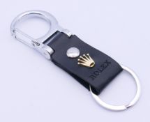 A Rolex keyring in original packaging and box. 10 cm high.