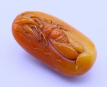 A model pebble with cicada. 8.5 x 4.5 cm.