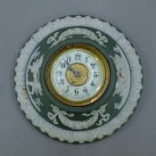 A green Jasperware porcelain table clock of circular form. 14 cm diameter.