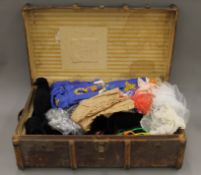 A vintage trunk and vintage cases containing various linen, lace,