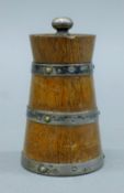 A silver-mounted oak pepper grinder. 9.5 cm high.