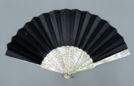 A Victorian and later mother-of-pearl fan. 27 cm long.
