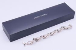 A boxed Georg Jensen silver infinity bracelet. 19 cm long.
