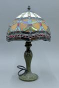 A Tiffany-style lamp. 45 cm high.