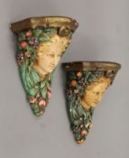 A pair of vintage painted plaster wall brackets. Each 26 cm high.