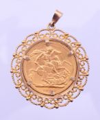 A George V 1912 gold sovereign in a 9 ct gold pendant mount. 3.25 cm diameter. 11.