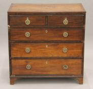 A George III inlaid mahogany chest of drawers. 80 cm wide x 82 cm high.