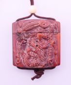 A small inro with dragons. 4.25 cm high.