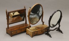 Three 19th century mahogany toilet mirrors. The largest 44 cm wide.