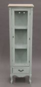 A green painted display cabinet. 160 cm high x 47 cm wide.