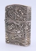 A Chinese white metal lighter. 6 cm high.