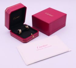 A pair of boxed Cartier 18 ct tri-coloured gold earrings, each 2 cm high. with Cartier certificate.