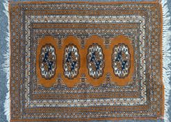 A red ground rug. 74 x 97 cm.