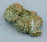 An Inuit carving of a polar bear, indistinctly signed and dated '99. 15 cm long.