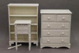 A white painted chest of drawers, bookcase and pot cupboard. The former 75 cm wide.
