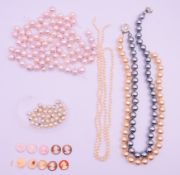A two strand pearl necklace, a quantity of loose pearls/beads and a quantity of loose cameos.