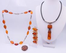 Various amber and silver jewellery to include two necklaces, a bracelet and a pendant. Pendant 3.