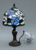 A Tiffany-style lamp. 35 cm high.
